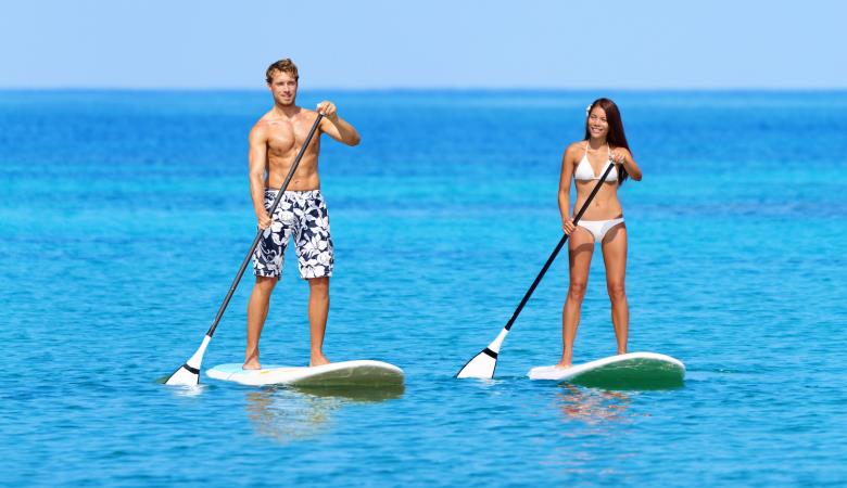 Stand up paddleboard beach people on paddle board